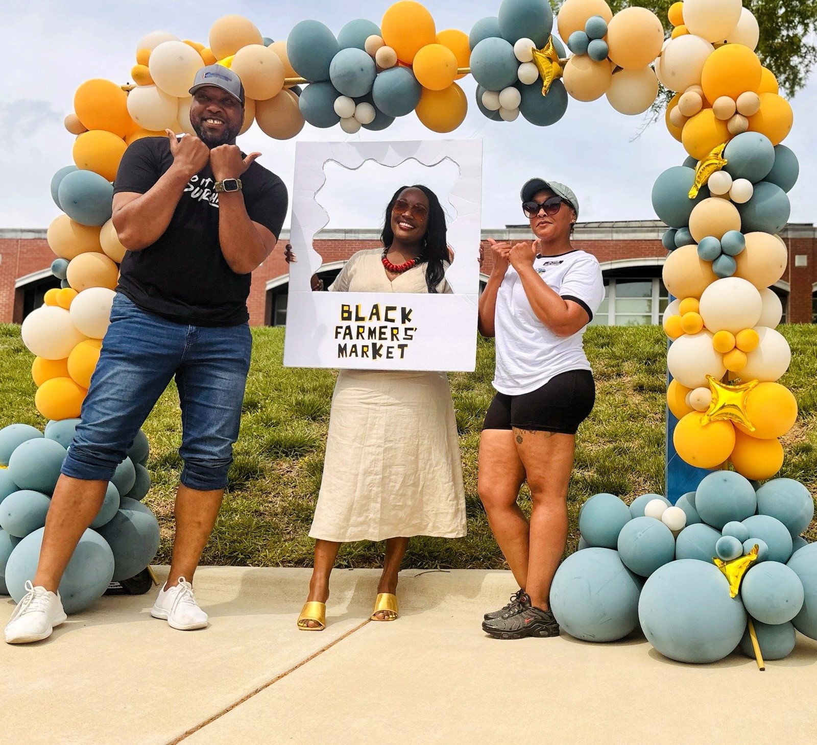 Pictured: Durham Mayor Leonardo Williams, NC Senator Natalie Murdock, and a Black Farmers Market employee; Credit: Stacey Motley